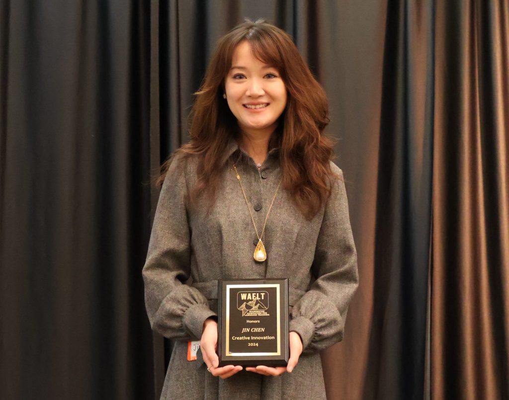 Founder Jin Chen receiving WAFLT Innovation Award for NewConcept Education